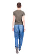 © ghoststone - back view of walking  woman in jeans .
