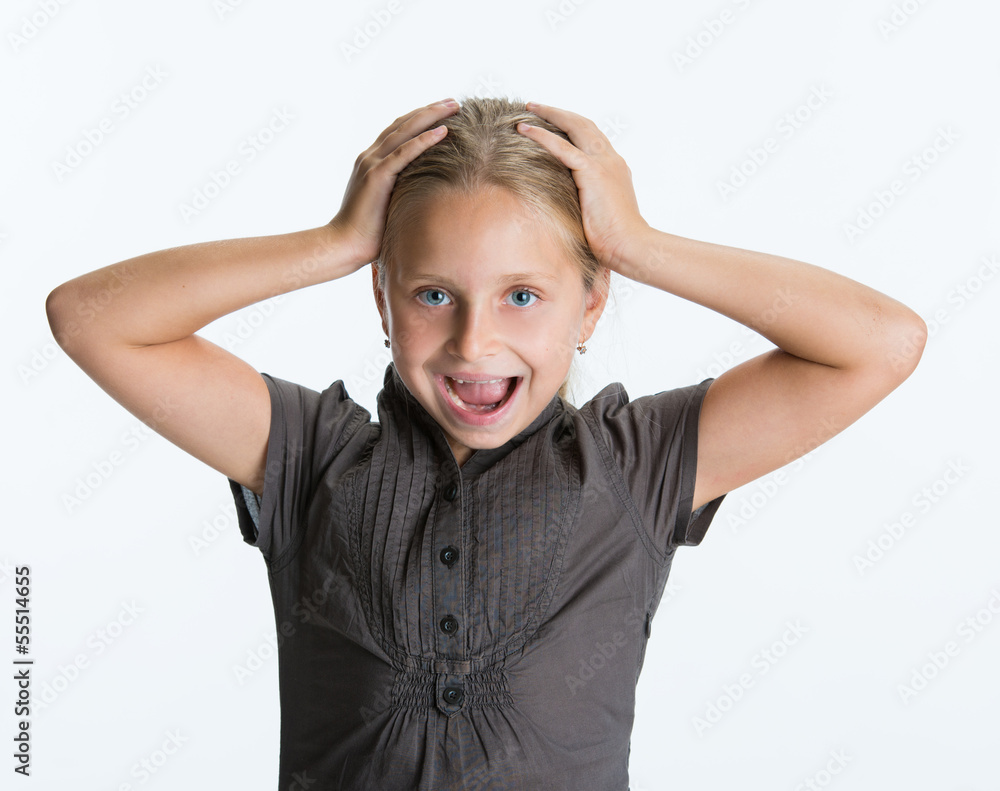 Surprised little girl kid with hands on her head Stock Photo | Adobe Stock