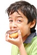 Little boy eating donut chocolate white background