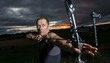 © Alexey Zarodov - Man with bow and arrows