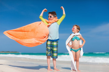 Poster - Superhero play at a beach