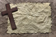 Wooden cross on old paper