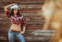 Cowgirl Model Posing On Farm