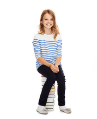 Sticker - little student girl sitting on stack of books