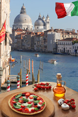 Wall Mural - Classic Italian pizza in Venice against canal, Italy