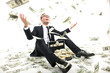 © BlueSkyImages - I am rich! Happy young businessman in formalwear throwing money