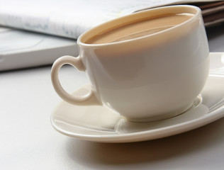 Cup of coffee near press