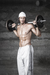 Wall Mural - Handsome bodybuilder posing in front of the camera