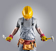 builder in a helmet with a hammer and a wrench