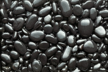 Black Wet Pebble As A Background