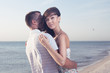© rasstock - Portrait Of Happy Beautiful Couple Enjoying At Beach