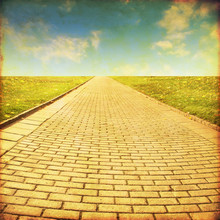 Grunge Image Of Stone Pathway In The Field.