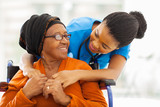 Fototapeta Psy - african senior patient with female nurse