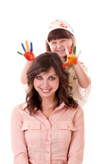 Happy family, young  mother and her daughter with color paint