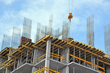 Building Construction Site Work Against Blue Sky