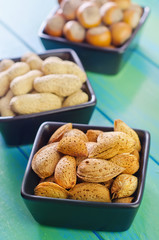 Poster - nuts in black bowls