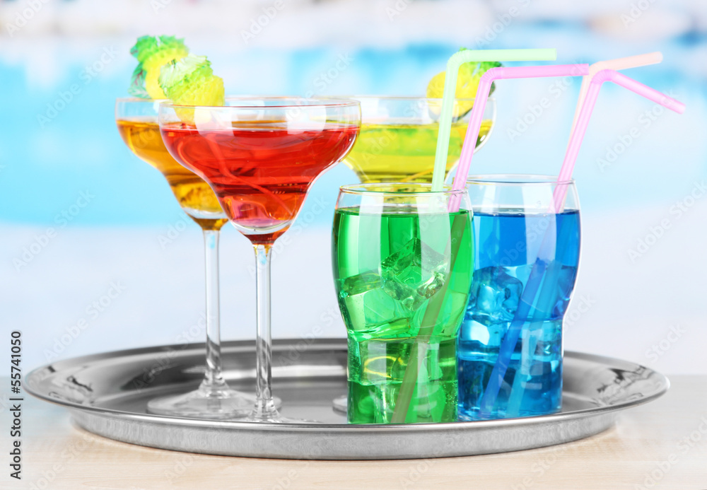 Different  colorful cocktails on bright background