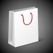 White bag with a red handle