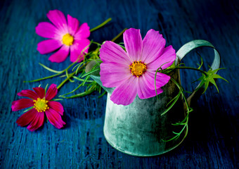 Wall Mural - Flowers in a jar in a vintage style on a blue background