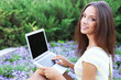 © Africa Studio - Beautiful young girl with laptop in park