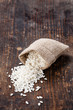 © Natalia Lisovskaya - Raw white rice in burlap bag