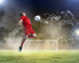 Fototapeta  - football player striking the ball