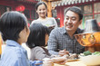 © xixinxing - Family enjoying a traditional Chinese meal