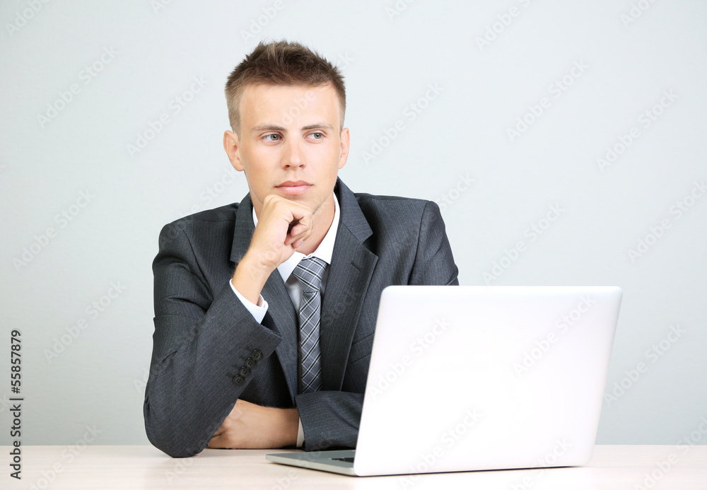Portrait of young businessman working in office