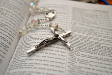 Rosary Beads On An Open Bible