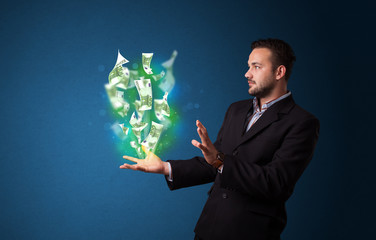 Wall Mural - Glowing money in the hand of a businessman