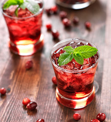 Wall Mural - cranberry cocktail with mint garnish.