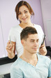 © Kadmy - Cheerful hairdresser in beauty salon