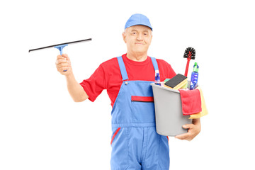 Wall Mural - Mature male cleaner holding a bucket with cleaning equipment