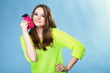 © Voyagerix - Happy girl with mobile phone in pink cover