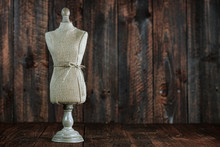 Antique Mannequin Busts On Wood Grunge Background