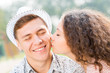 © adam121 - girl kissing a man on the cheek