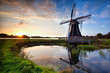charming Dutch windmill at sunset