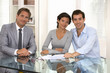 © ldprod - Happy young couple signing financial contract, looking camera