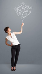 Happy woman holding smiling balloons drawing