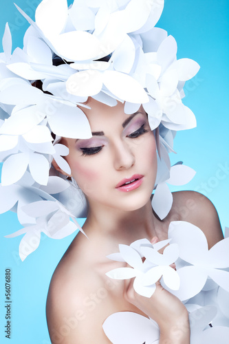 Naklejka na szybę Wonderful girl in a hat from paper white butterflies. On a blue 