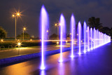 Fototapeta Miasto - The illuminated fountain at night