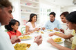 © Monkey Business - Multi Generation Indian Family Eating Meal At Home