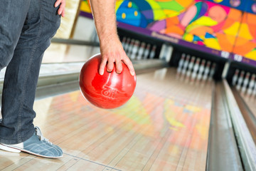 Young man bowling having fun