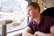 © Monkey Business - Young Man Listening To Music On Train Journey