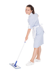 Young Maid Cleaning Floor With Mop