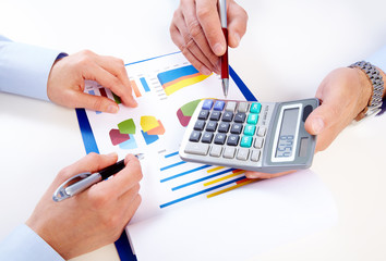 Aufkleber - Hands of business people with calculator.