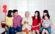 © szeyuen - Asian three generations family celebrating chinese new year