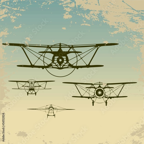 Naklejka - mata magnetyczna na lodówkę Old planes flying in the clouds, retro aviation background.