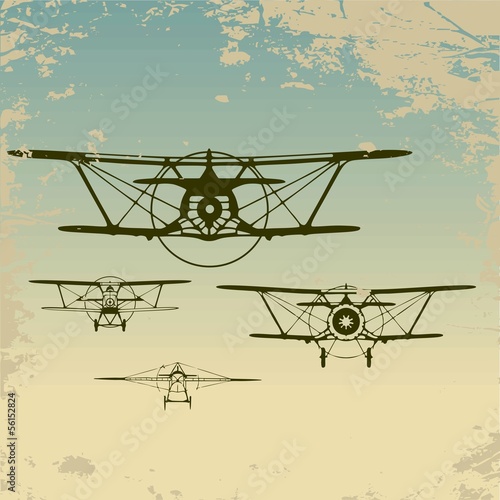 Fototapeta na wymiar Old planes flying in the clouds, retro aviation background.