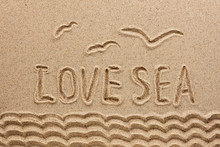 The Word  Sea  Written On The Sand
